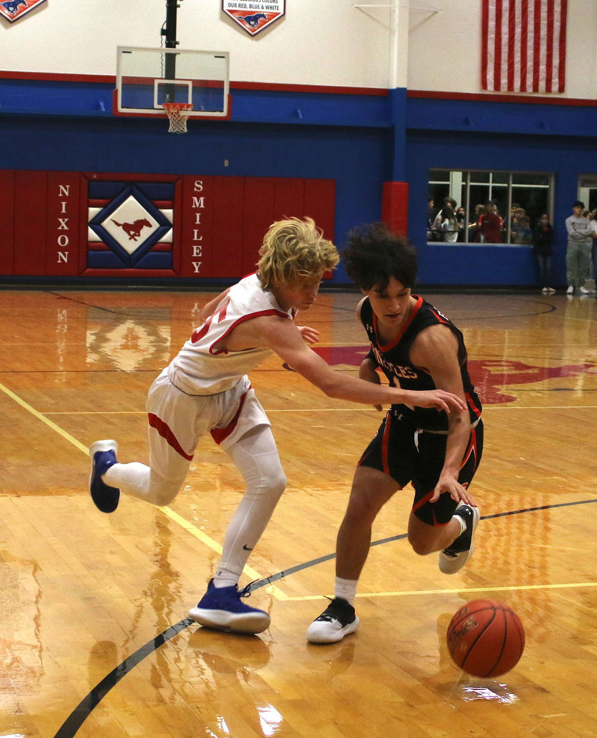 Gonzales' Brady Barfield steals the ball from Luke Moses of Nixon-Smiley in an earlier game. Barfield scored seven against St. Anthony in a 70-62 win on Dec. 17.